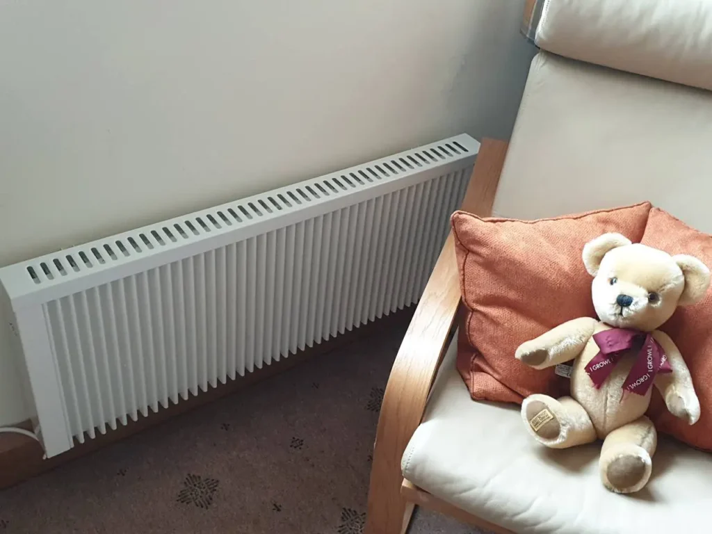 Electric Radiator Next to a Chair