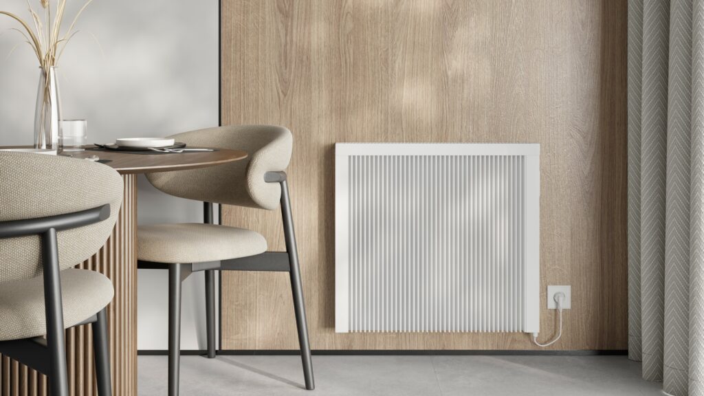 Compact RadTherm electric radiator on a kitchen wall